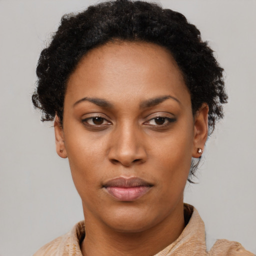 Neutral black young-adult female with short  black hair and brown eyes