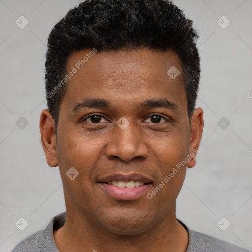 Joyful black young-adult male with short  black hair and brown eyes