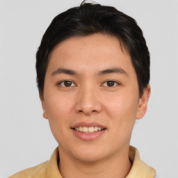 Joyful asian young-adult male with short  brown hair and brown eyes