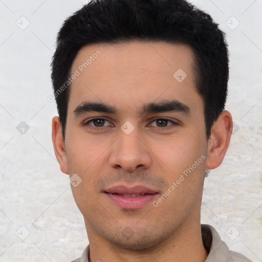 Joyful white young-adult male with short  black hair and brown eyes