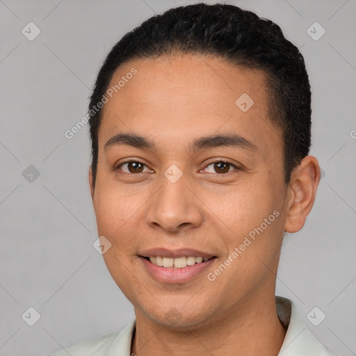 Joyful white young-adult male with short  black hair and brown eyes