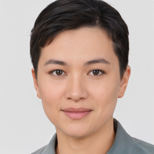 Joyful white young-adult female with short  black hair and brown eyes