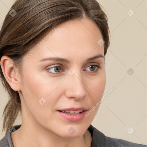 Joyful white young-adult female with medium  brown hair and blue eyes