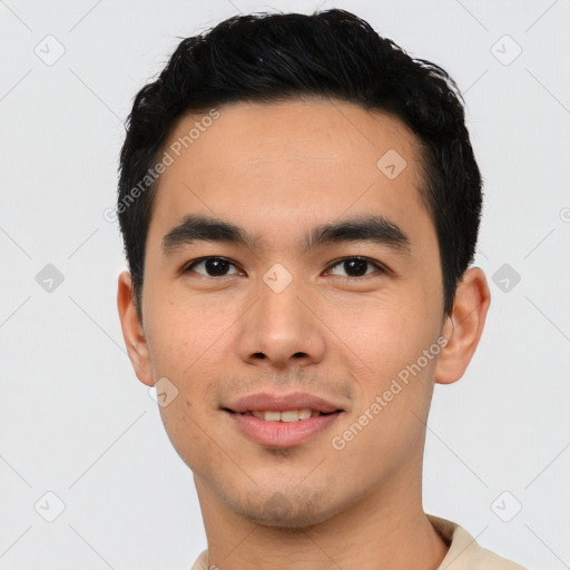 Joyful asian young-adult male with short  black hair and brown eyes