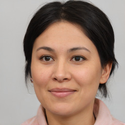 Joyful asian young-adult female with medium  brown hair and brown eyes