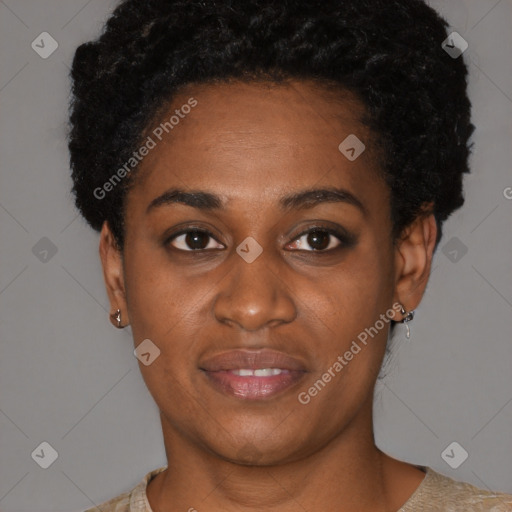 Joyful black young-adult female with short  black hair and brown eyes