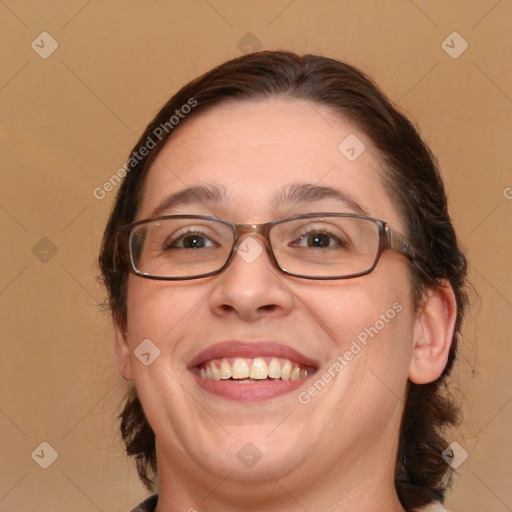 Joyful white adult female with medium  brown hair and brown eyes