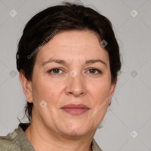 Joyful white adult female with medium  brown hair and grey eyes