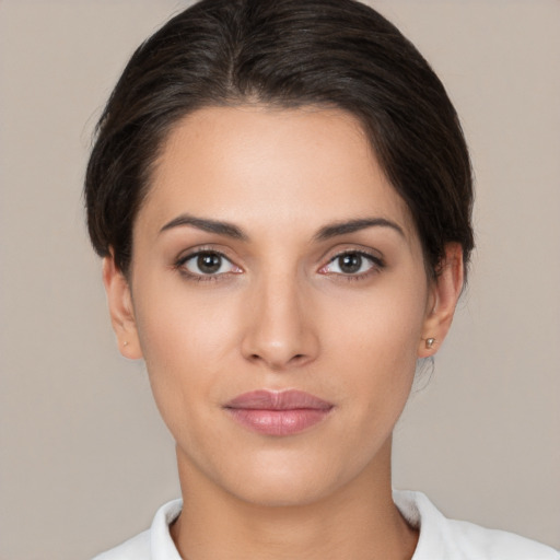 Joyful white young-adult female with medium  brown hair and brown eyes