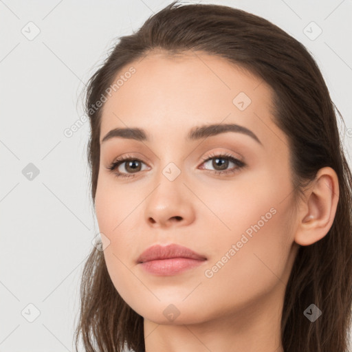 Neutral white young-adult female with long  brown hair and brown eyes