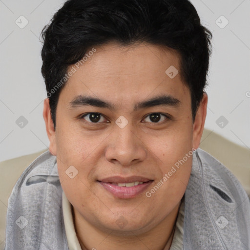 Joyful latino young-adult male with short  brown hair and brown eyes