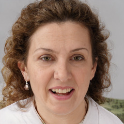 Joyful white adult female with medium  brown hair and blue eyes