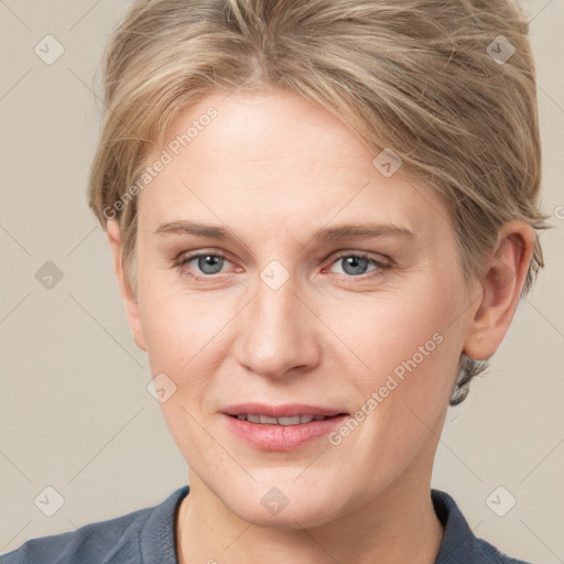 Joyful white adult female with short  brown hair and grey eyes