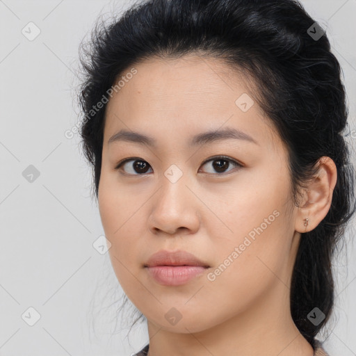 Joyful asian young-adult female with long  brown hair and brown eyes