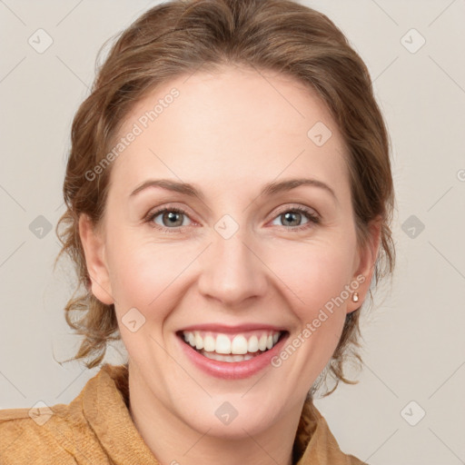 Joyful white young-adult female with medium  brown hair and blue eyes