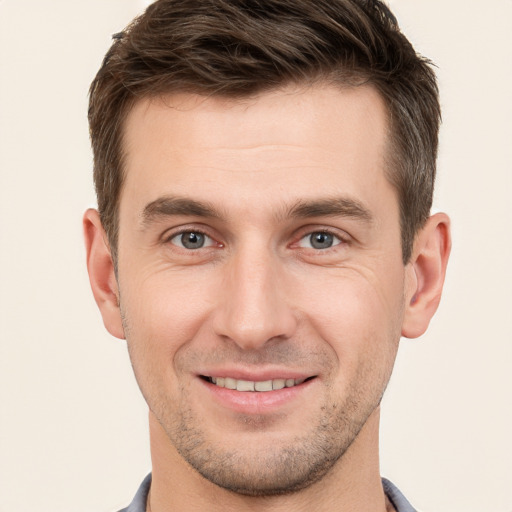 Joyful white young-adult male with short  brown hair and brown eyes