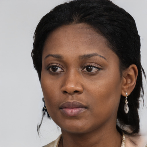 Neutral black young-adult female with long  black hair and brown eyes