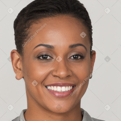 Joyful black young-adult female with short  brown hair and brown eyes