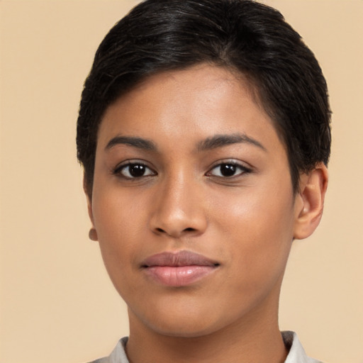 Joyful latino young-adult female with short  brown hair and brown eyes