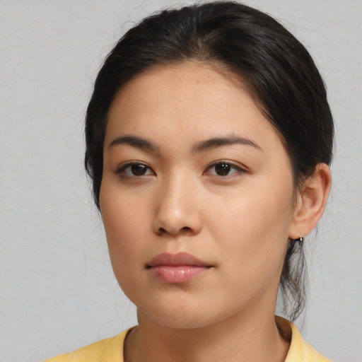 Neutral asian young-adult female with medium  brown hair and brown eyes