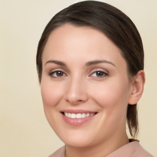 Joyful white young-adult female with medium  brown hair and brown eyes