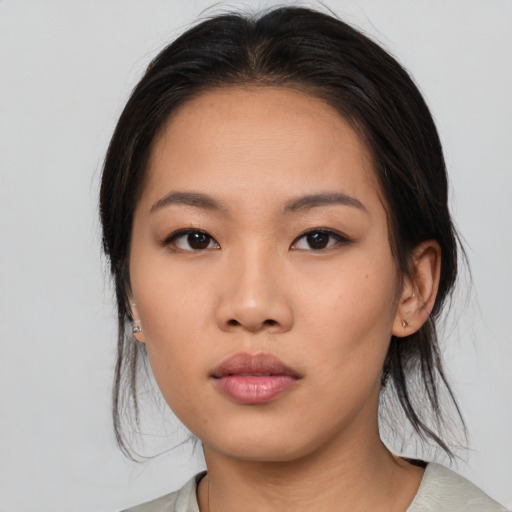 Neutral asian young-adult female with medium  black hair and brown eyes