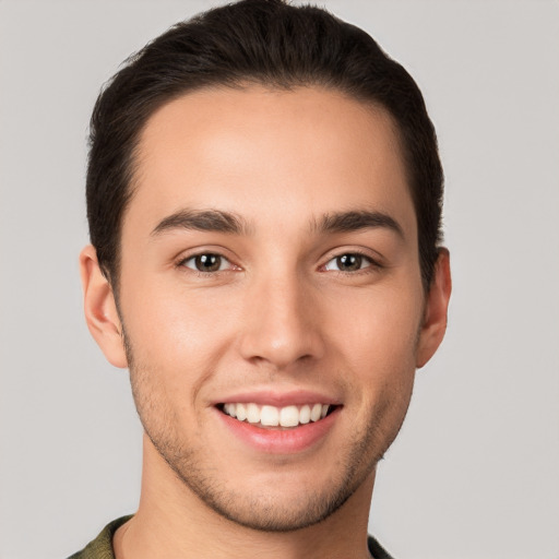 Joyful white young-adult male with short  brown hair and brown eyes