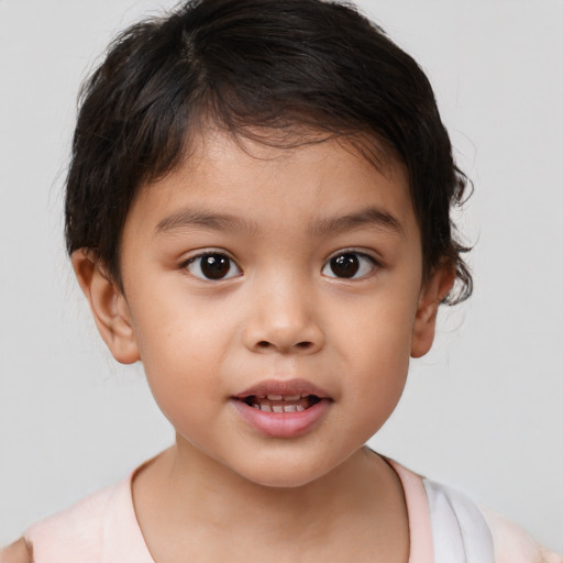 Joyful white child female with short  brown hair and brown eyes