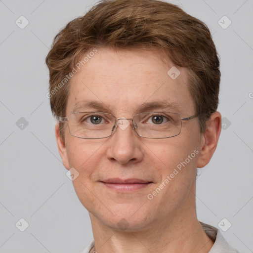 Joyful white adult female with short  brown hair and grey eyes