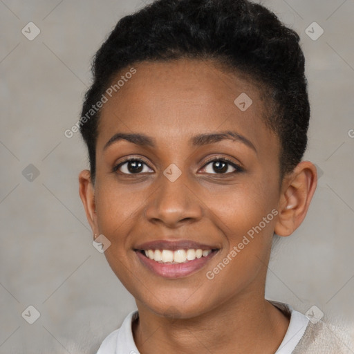 Joyful black young-adult female with short  brown hair and brown eyes