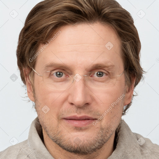 Joyful white adult male with short  brown hair and grey eyes