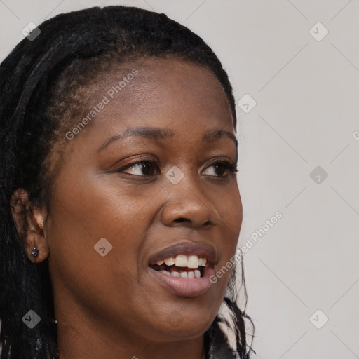 Joyful black young-adult female with long  brown hair and brown eyes