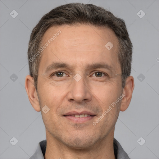 Joyful white adult male with short  brown hair and brown eyes