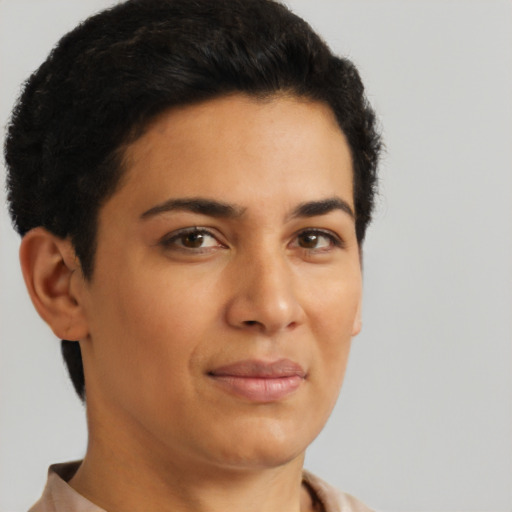 Joyful latino young-adult female with short  brown hair and brown eyes