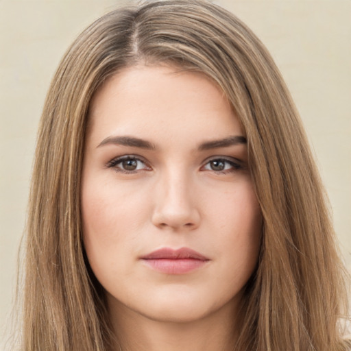 Neutral white young-adult female with long  brown hair and brown eyes