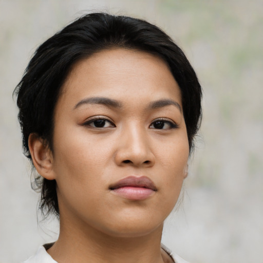 Neutral latino young-adult female with medium  brown hair and brown eyes