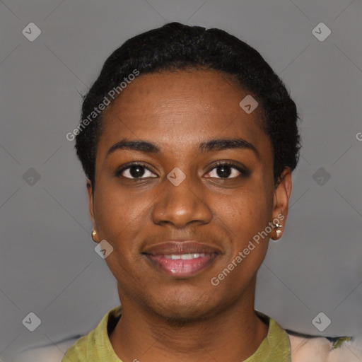 Joyful black young-adult female with short  black hair and brown eyes