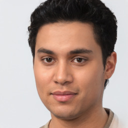 Joyful latino young-adult male with short  brown hair and brown eyes