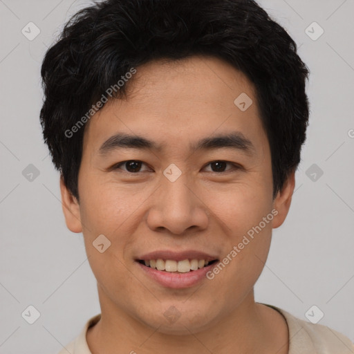 Joyful asian young-adult male with short  black hair and brown eyes