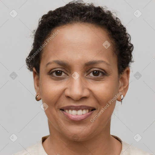 Joyful black adult female with short  brown hair and brown eyes