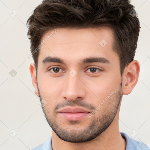 Neutral white young-adult male with short  brown hair and brown eyes