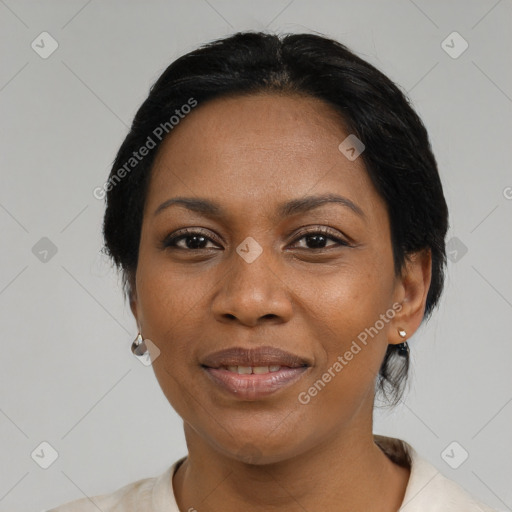 Joyful black adult female with medium  black hair and brown eyes