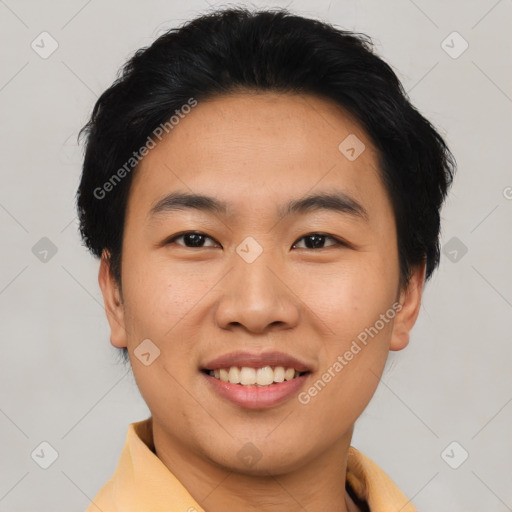 Joyful asian young-adult male with short  black hair and brown eyes