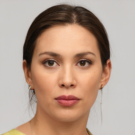 Joyful white young-adult female with medium  brown hair and brown eyes