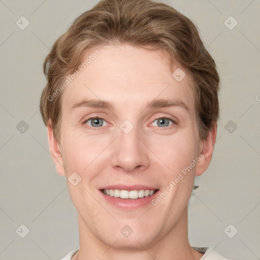 Joyful white young-adult female with short  brown hair and grey eyes