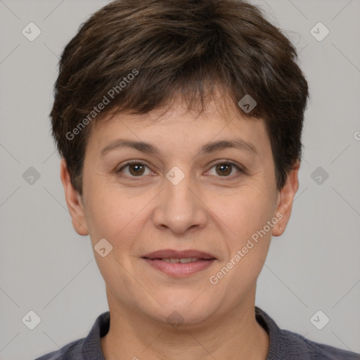 Joyful white adult female with short  brown hair and brown eyes