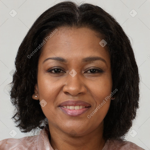 Joyful black adult female with medium  brown hair and brown eyes