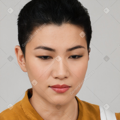 Joyful asian young-adult female with short  black hair and brown eyes