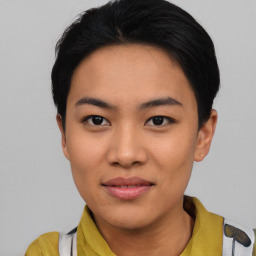 Joyful asian young-adult female with short  black hair and brown eyes