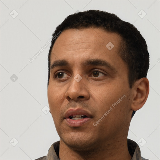 Neutral white young-adult male with short  black hair and brown eyes
